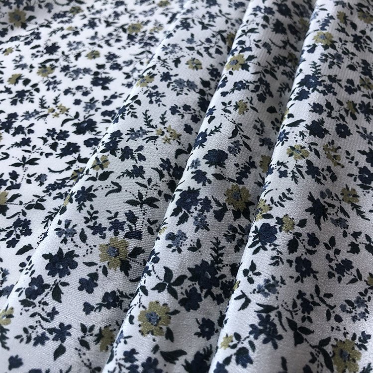 Crepe De Chine With Blue Flowers On White Fabric
